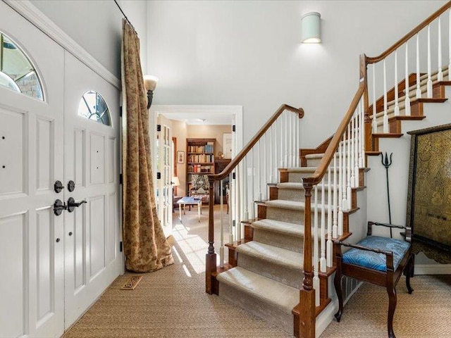 140 Fairway Dr, Missoula, MT 59803 - foyer featuring a towering ceiling, carpet, and stairs