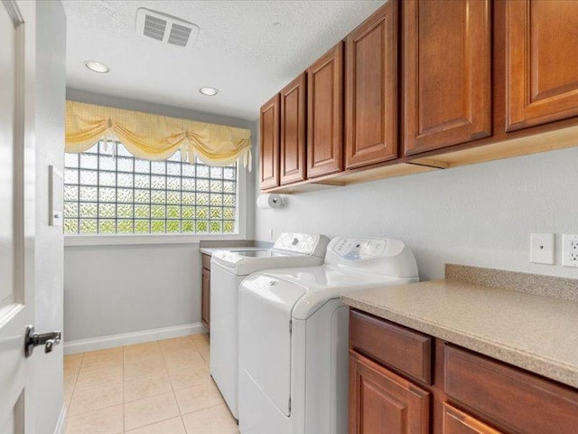 140 Fairway Dr, Missoula, MT 59803 - washroom with cabinet space, independent washer and dryer, recessed lighting, light tile patterned floors, and a textured ceiling