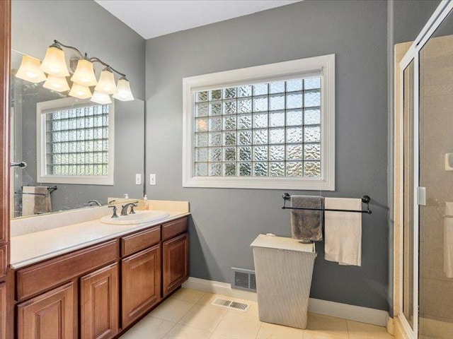 140 Fairway Dr, Missoula, MT 59803 - full bathroom featuring vanity, plenty of natural light, a shower stall, and tile patterned floors