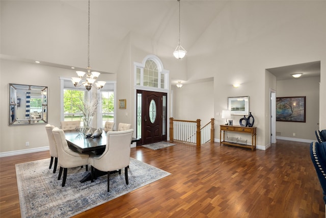 65 Glacier Cir, Kalispell, MT 59901 - dining space featuring dark wood-style floors, a chandelier, baseboards, and high vaulted ceiling