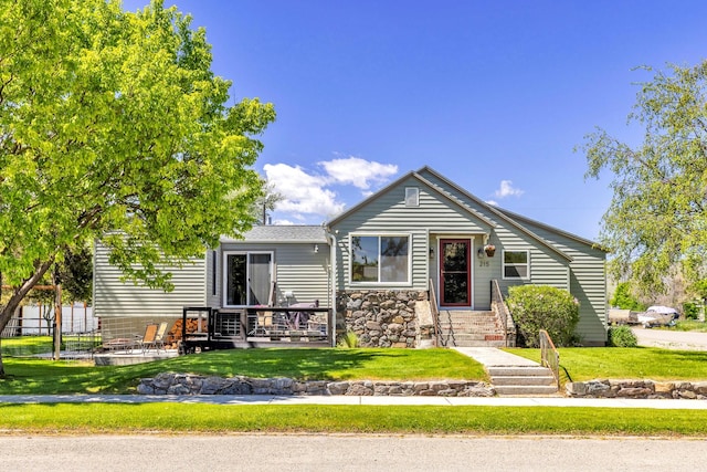 215 N Oak St, Townsend, MT 59644 - view of front of house with stone siding and a deck