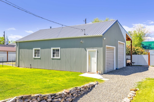 215 N Oak St, Townsend, MT 59644 - back of house with a metal roof, a standing seam roof, an outbuilding, and a detached garage