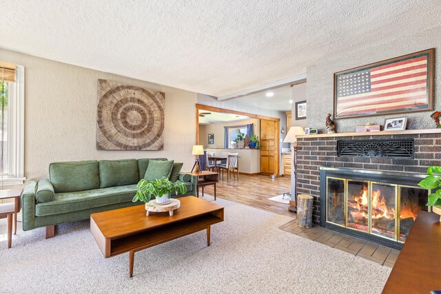 215 N Oak St, Townsend, MT 59644 - living area featuring a textured ceiling, a fireplace, carpet, a textured wall, and recessed lighting
