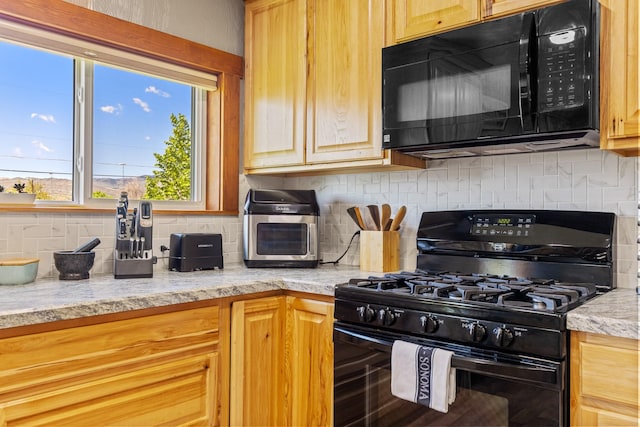 215 N Oak St, Townsend, MT 59644 - kitchen with black appliances, decorative backsplash, and light stone countertops