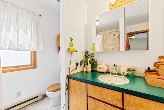 215 N Oak St, Townsend, MT 59644 - full bathroom featuring a baseboard heating unit, vanity, and a shower with curtain