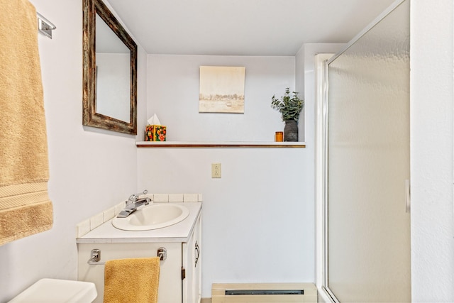 215 N Oak St, Townsend, MT 59644 - full bathroom with a stall shower, vanity, and a baseboard heating unit