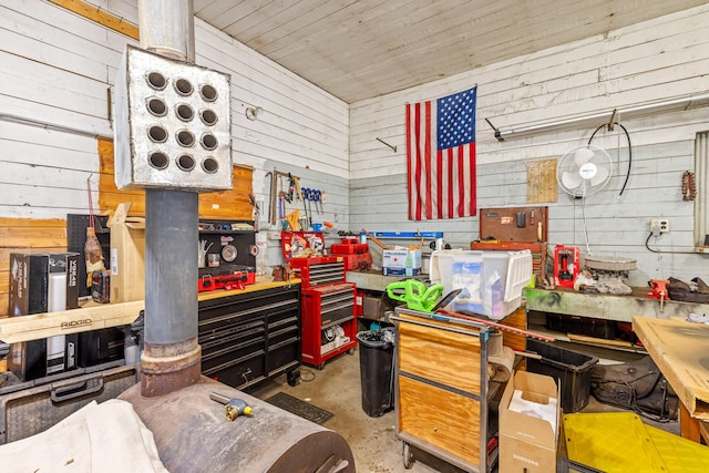 215 N Oak St, Townsend, MT 59644 - miscellaneous room featuring concrete flooring, a workshop area, and wood walls