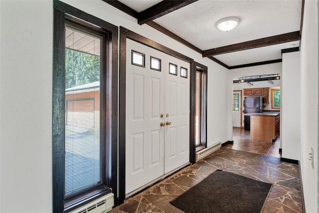 1165 Rock Creek Rd, Clinton, MT 59825 - foyer with stone flooring, beamed ceiling, and a baseboard heating unit