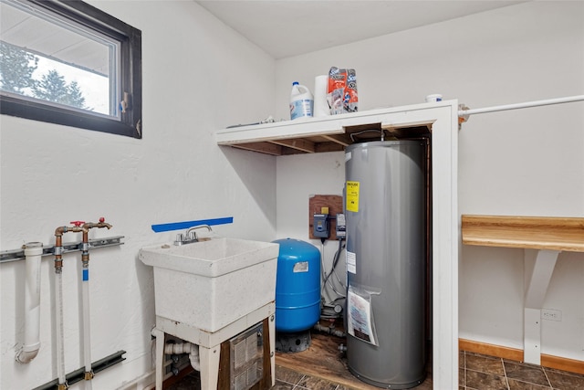 1165 Rock Creek Rd, Clinton, MT 59825 - utility room featuring electric water heater and a sink