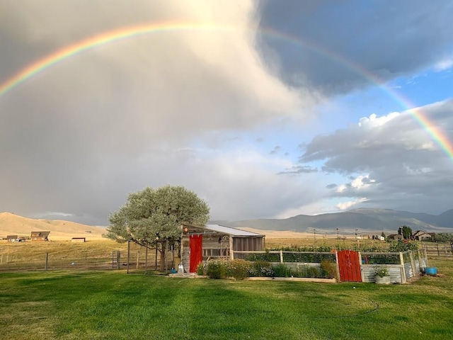 49 Redtail Hawk Rd, Mcallister, MT 59740 - view of yard featuring a mountain view, a vegetable garden, and a rural view