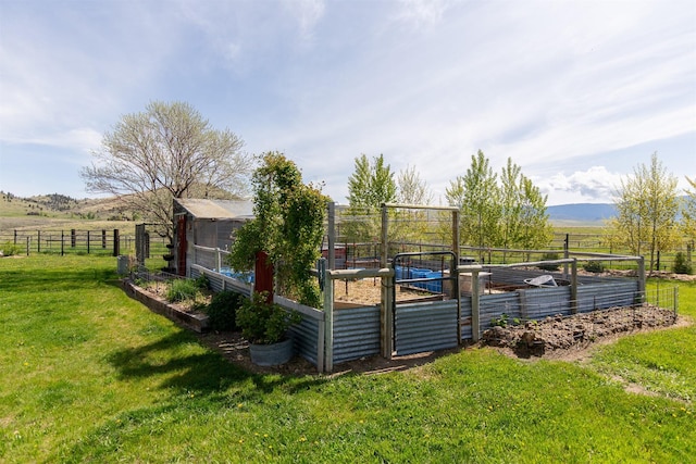 49 Redtail Hawk Rd, Mcallister, MT 59740 - view of pool featuring a vegetable garden, a rural view, and an outdoor structure