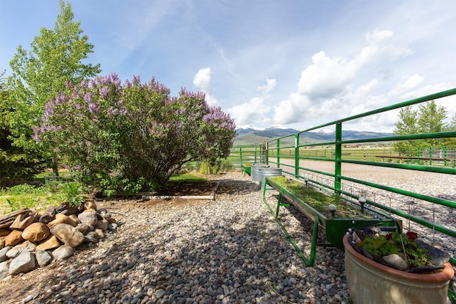 49 Redtail Hawk Rd, Mcallister, MT 59740 - view of yard featuring a rural view, an exterior structure, and a mountain view