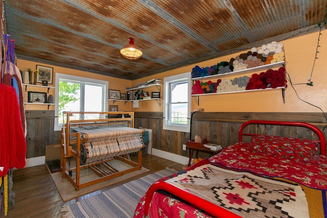 49 Redtail Hawk Rd, Mcallister, MT 59740 - bedroom with a wainscoted wall, wood finished floors, wood walls, and wooden ceiling