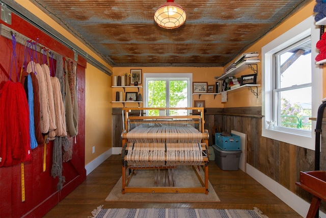 49 Redtail Hawk Rd, Mcallister, MT 59740 - bedroom featuring wood finished floors and a wainscoted wall