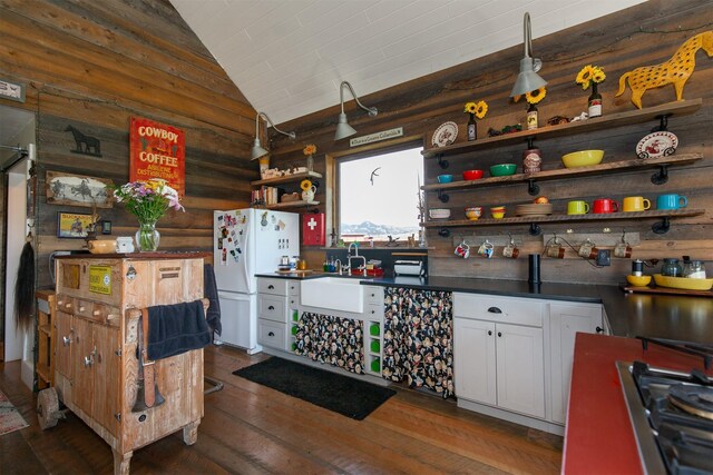 49 Redtail Hawk Rd, Mcallister, MT 59740 - kitchen featuring open shelves, freestanding refrigerator, gas stovetop, dark countertops, and vaulted ceiling