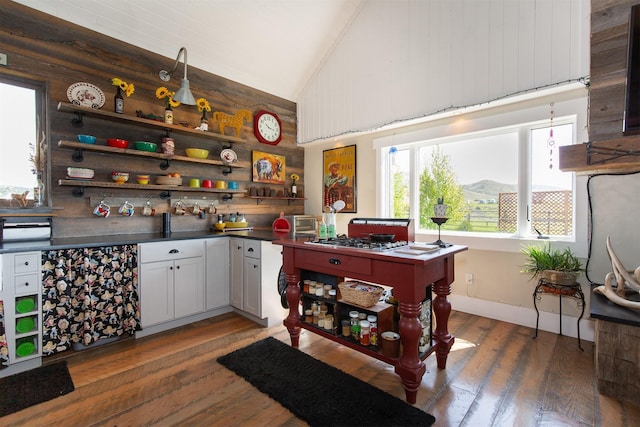 49 Redtail Hawk Rd, Mcallister, MT 59740 - indoor bar with hardwood / wood-style floors, wood walls, stainless steel gas stovetop, and high vaulted ceiling