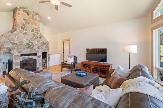 36 Lost Trl, Clancy, MT 59634 - living area with wood finished floors, a ceiling fan, vaulted ceiling, and a stone fireplace
