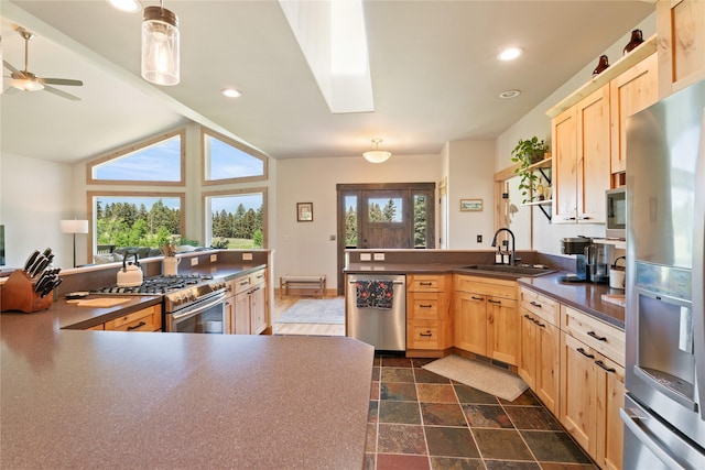 36 Lost Trl, Clancy, MT 59634 - kitchen featuring appliances with stainless steel finishes, light brown cabinetry, a sink, dark countertops, and recessed lighting