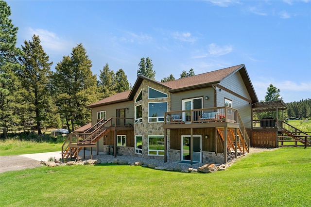 36 Lost Trl, Clancy, MT 59634 - rear view of property featuring stairway, stone siding, a wooden deck, and a lawn