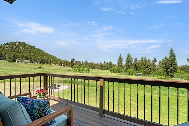 36 Lost Trl, Clancy, MT 59634 - wooden deck featuring a yard and a wooded view