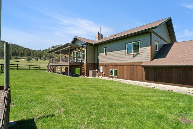 36 Lost Trl, Clancy, MT 59634 - back of property featuring a pergola, central AC unit, and a chimney