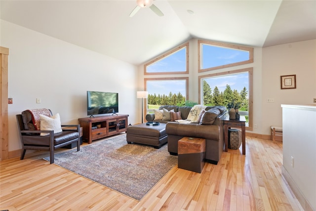 36 Lost Trl, Clancy, MT 59634 - living area with light wood-style flooring, a ceiling fan, baseboards, and high vaulted ceiling