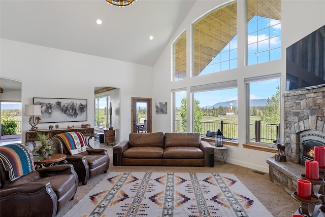 310 Jossie Ln, Kalispell, MT 59901 - living room with high vaulted ceiling, carpet flooring, baseboards, and recessed lighting