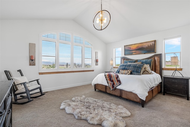 310 Jossie Ln, Kalispell, MT 59901 - bedroom with a chandelier, multiple windows, light colored carpet, lofted ceiling, and baseboards