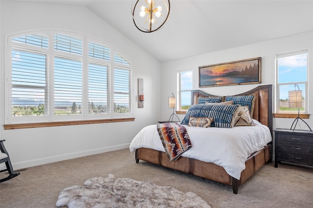 310 Jossie Ln, Kalispell, MT 59901 - bedroom featuring vaulted ceiling, a chandelier, light colored carpet, and baseboards