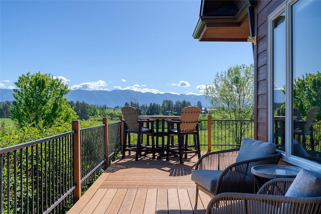 310 Jossie Ln, Kalispell, MT 59901 - wooden terrace featuring a mountain view