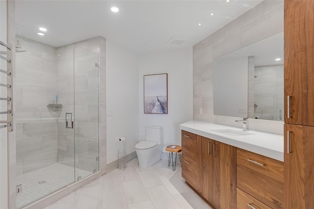 310 Jossie Ln, Kalispell, MT 59901 - full bath featuring vanity, toilet, a stall shower, recessed lighting, and tile patterned floors