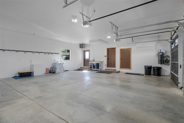 310 Jossie Ln, Kalispell, MT 59901 - garage featuring a central vacuum unit and a garage door opener