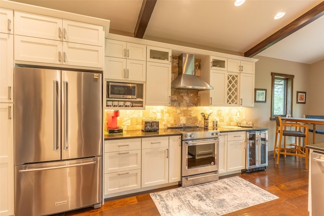 161 Hastings Trl, Columbia Falls, MT 59912 - kitchen featuring stainless steel appliances, wall chimney range hood, wine cooler, beamed ceiling, and tasteful backsplash
