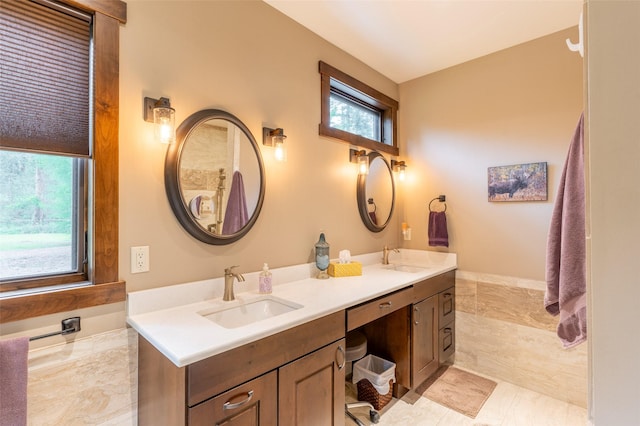 161 Hastings Trl, Columbia Falls, MT 59912 - full bathroom featuring plenty of natural light and double vanity