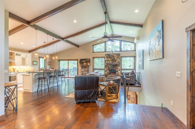161 Hastings Trl, Columbia Falls, MT 59912 - living room featuring ceiling fan, dark wood-style flooring, and a stone fireplace