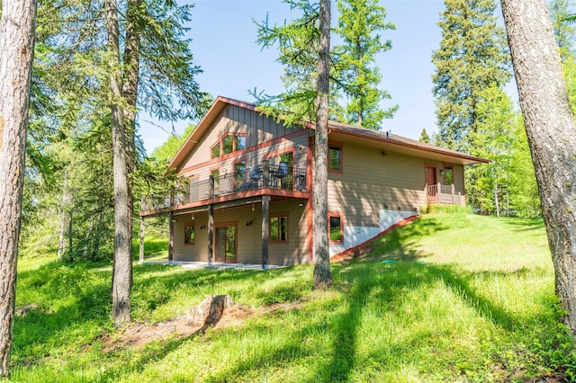161 Hastings Trl, Columbia Falls, MT 59912 - back of property with a deck and a yard