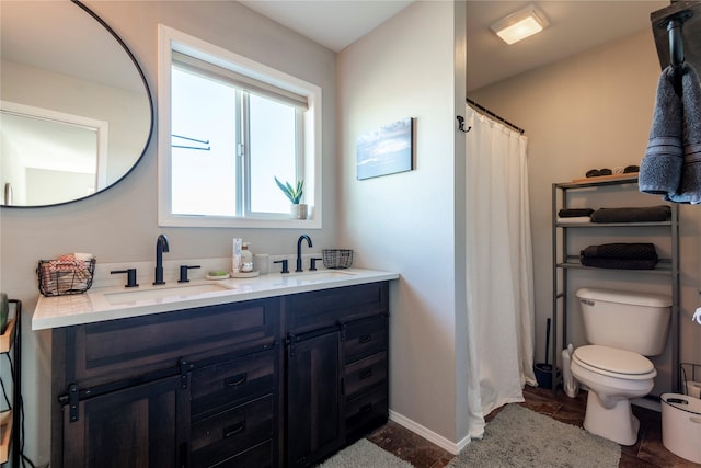 333 Darwin Rd, Helena, MT 59602 - full bath featuring double vanity, toilet, baseboards, and curtained shower