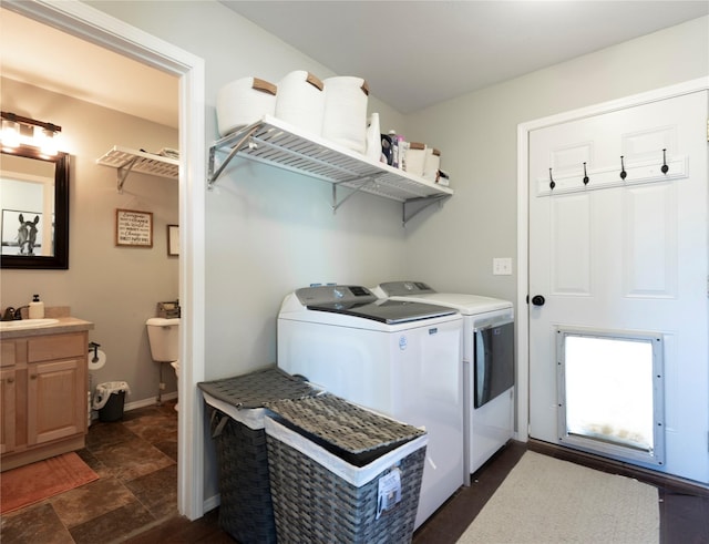 333 Darwin Rd, Helena, MT 59602 - laundry area featuring washing machine and clothes dryer and dark stone finish floors
