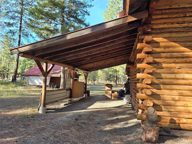 226 Powerline Way, Libby, MT 59923 - view of car parking with an attached carport and an exterior structure