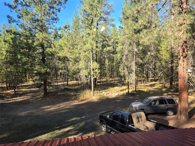 226 Powerline Way, Libby, MT 59923 - wooden deck featuring a wooded view