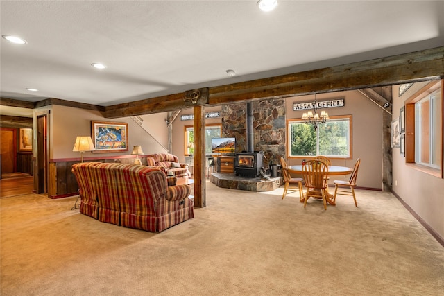 29 Gold Coin Rd, Hall, MT 59837 - living area with carpet, a wood stove, recessed lighting, a chandelier, and beam ceiling