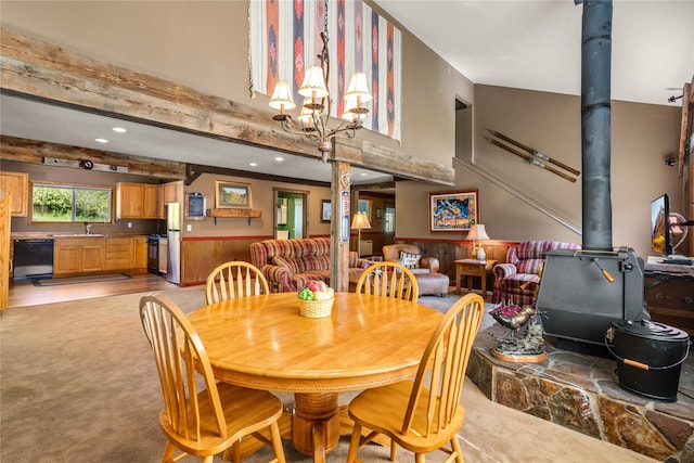29 Gold Coin Rd, Hall, MT 59837 - dining room with a wood stove, light carpet, recessed lighting, and a chandelier
