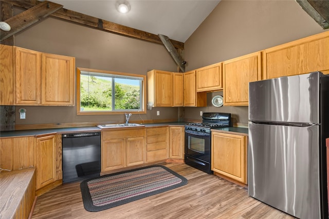 29 Gold Coin Rd, Hall, MT 59837 - kitchen featuring black appliances, high vaulted ceiling, a sink, light wood-type flooring, and beam ceiling