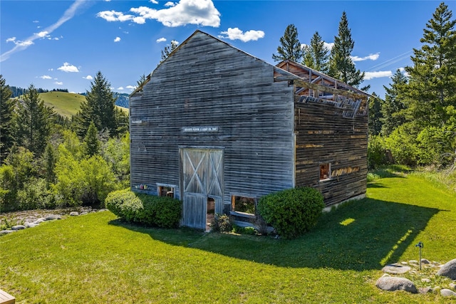 29 Gold Coin Rd, Hall, MT 59837 - view of side of property featuring a yard, a barn, and an outdoor structure