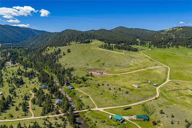 29 Gold Coin Rd, Hall, MT 59837 - aerial overview of property's location with a heavily wooded area, mountains, and rural landscape