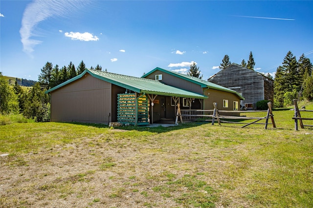 29 Gold Coin Rd, Hall, MT 59837 - rear view of property with metal roof and an outbuilding