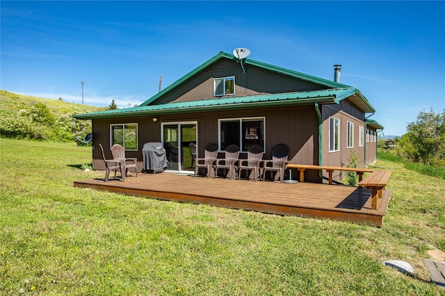29 Gold Coin Rd, Hall, MT 59837 - back of house featuring a yard, a deck, and metal roof