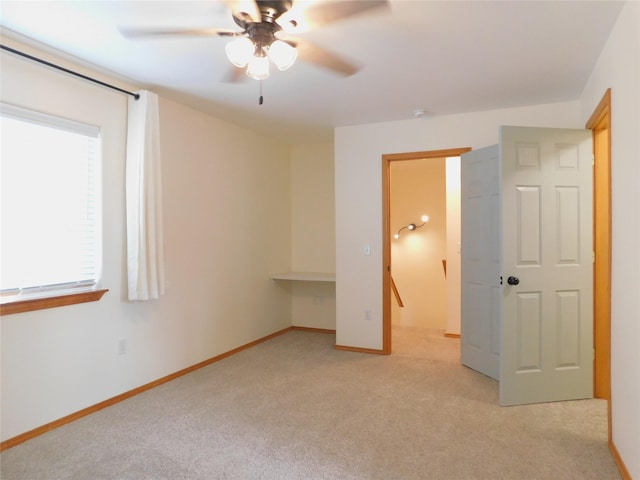 1960/1962 Greatview Dr, Kalispell, MT 59901 - unfurnished bedroom featuring light colored carpet, baseboards, and a ceiling fan