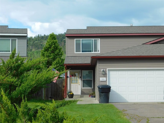 1960/1962 Greatview Dr, Kalispell, MT 59901 - view of front of home with asphalt driveway, a shingled roof, and a garage