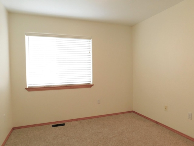 1960/1962 Greatview Dr, Kalispell, MT 59901 - spare room featuring light carpet and baseboards